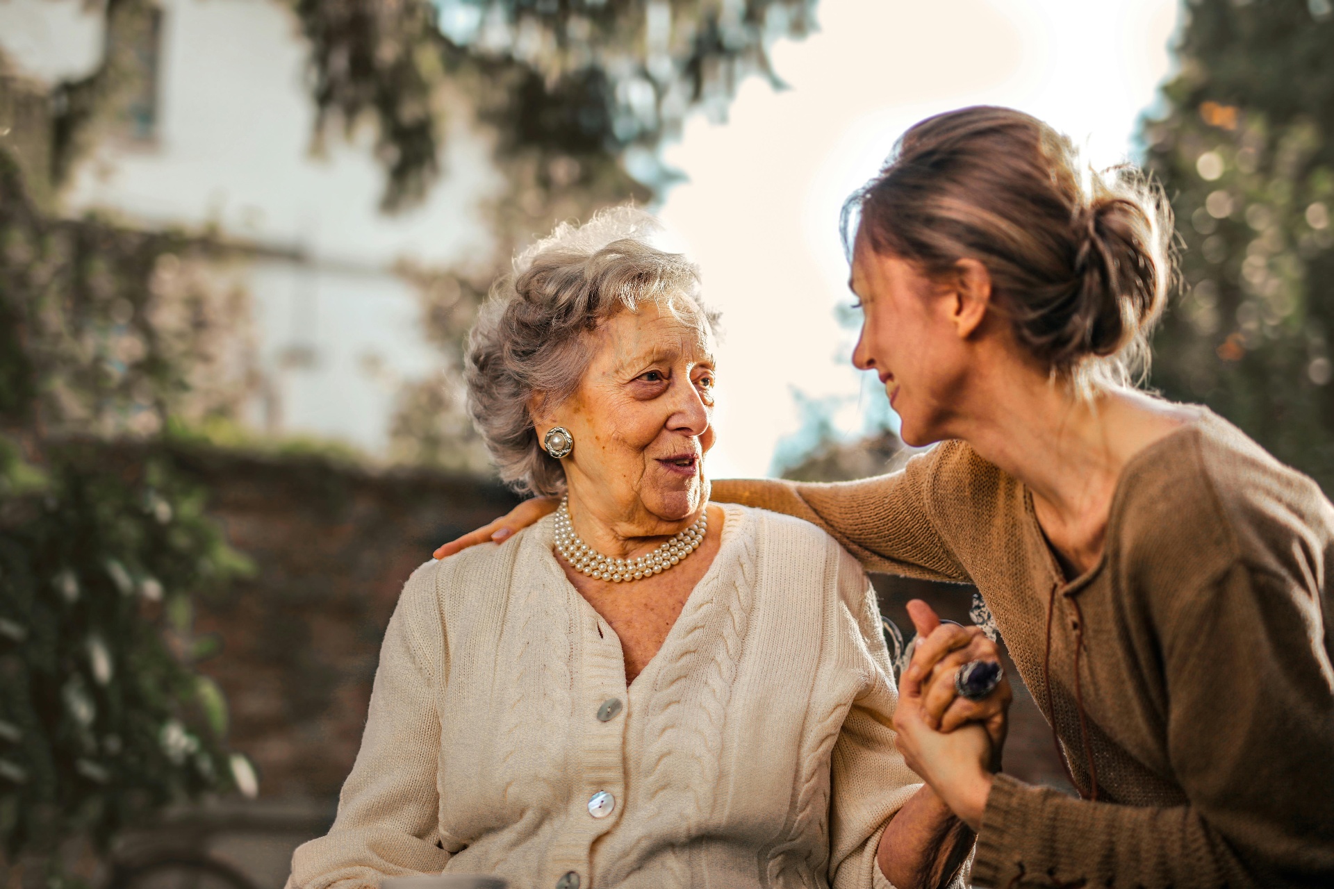 Happy elderly individual with caregiver